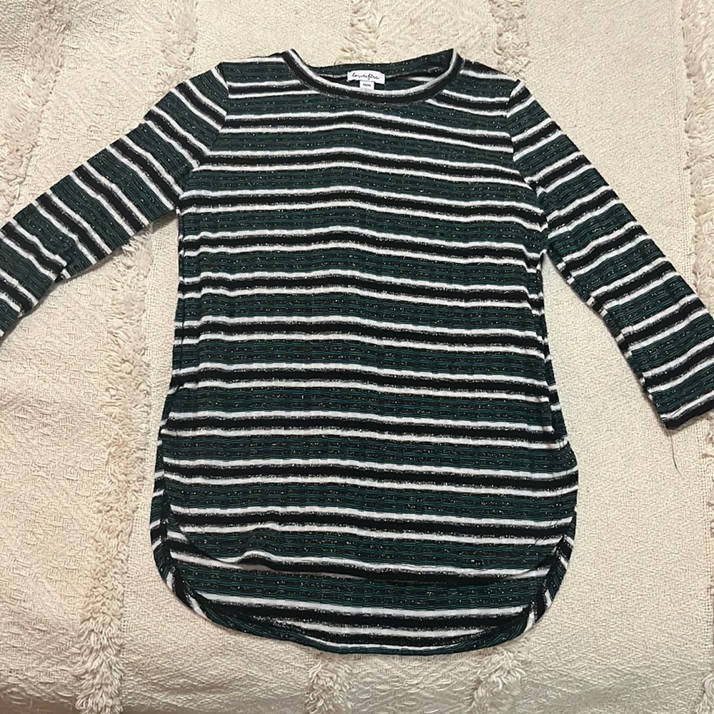 Green white and black shirt